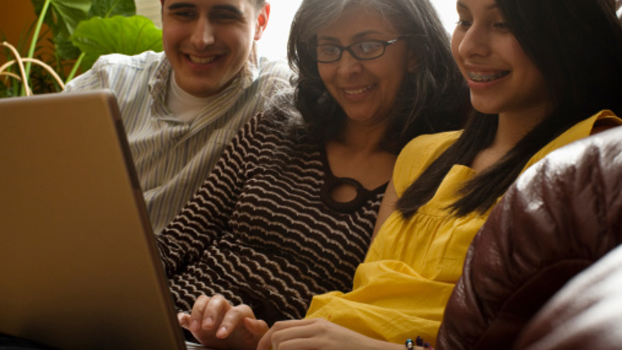 RESOURCE_AFC_family using laptop.jpg